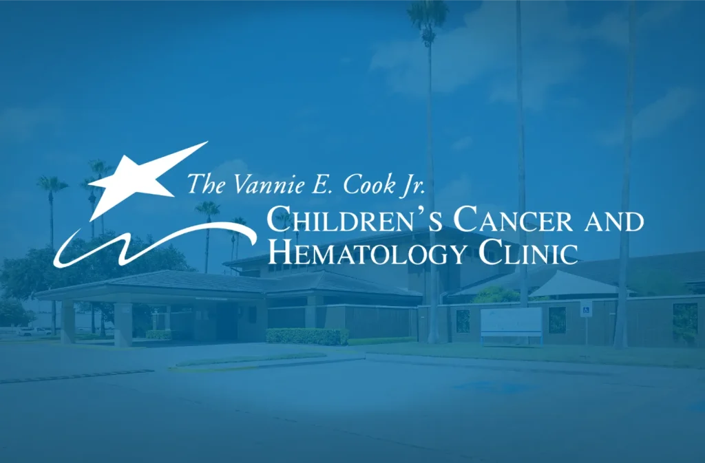 The Vannie E. Cook Jr. Children’s Cancer and Hematology Clinic logo over building background.